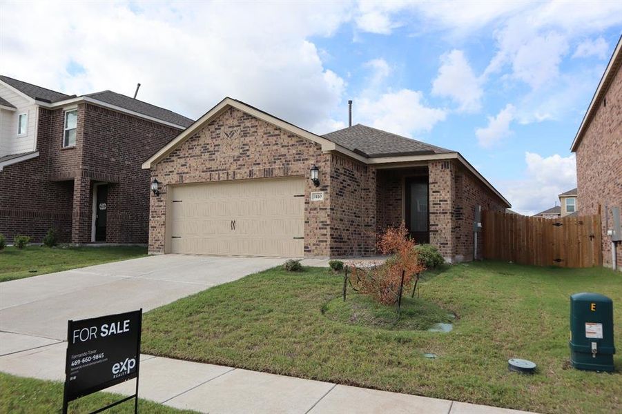 View of front of house with an attached garage, brick siding, a front lawn, concrete driveway, and roof with shingles View of front of house with an attached garage, brick siding, a front lawn, concrete driveway, and roof with shingles