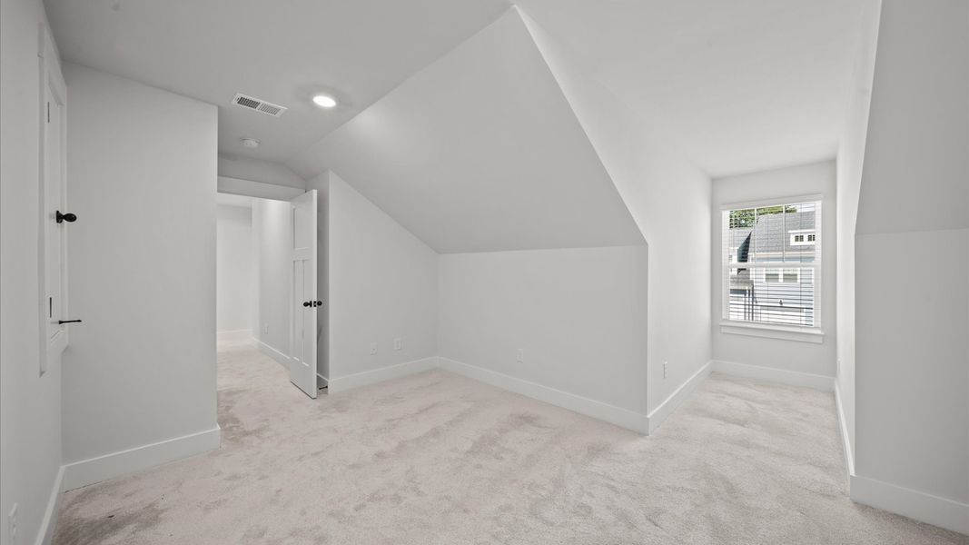 Inviting loft with cozy carpet, perfect for casual gatherings or quiet relaxation