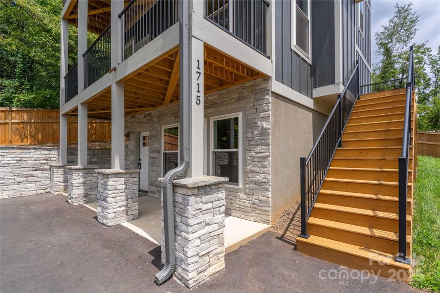 Primary entrance at basement level, and main level entrance up stairs