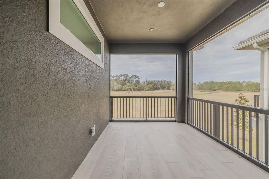 Screened Upstairs Balcony overlooking golf course