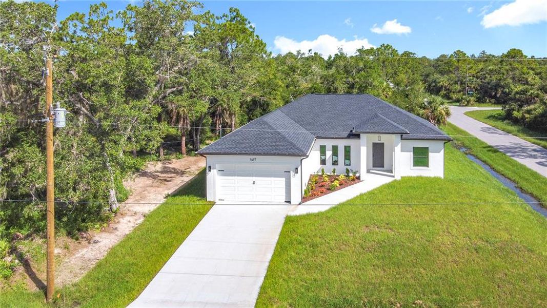 Front exterior of a new home in , Englewood, FL, highlighting curb appeal (Image 20).