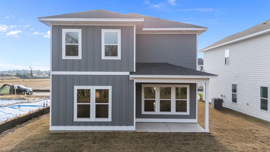 Exterior details and patio area of a home in Blue Heron Retreat: Oasis Series, Little River (Image 19).