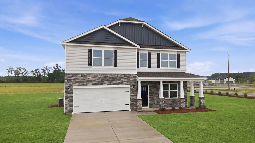 Front exterior of a new home in Dail Farm, Farmville, NC, highlighting curb appeal (Image 2). Front exterior of a new home in Dail Farm, Farmville, NC, highlighting curb appeal (Image 2).