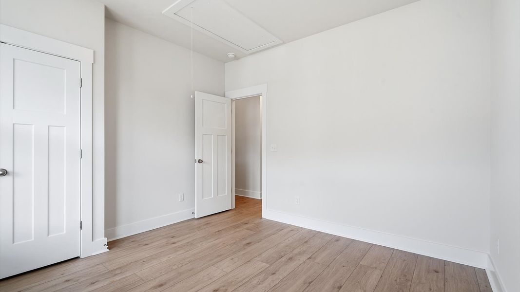 Thoughtfully designed secondary bedrooms featuring hardwood flooring and tasteful detail by DRB Homes Thoughtfully designed secondary bedrooms featuring hardwood flooring and tasteful detail by DRB Homes