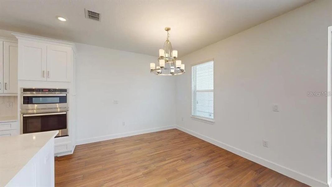 Spacious, unfurnished interior of a new home in Esplanade at Artisan Lakes, Palmetto (Image 8).