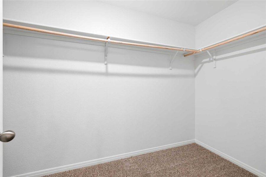 The primary walk-in closet. The primary walk-in closet.