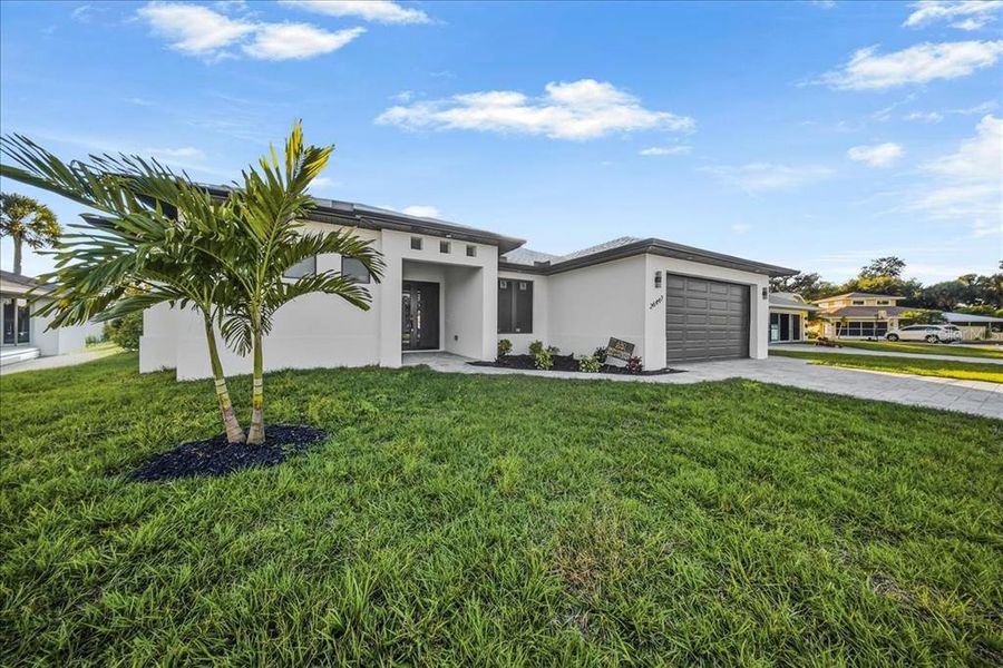 Front exterior of a new home in , Punta Gorda, FL, highlighting curb appeal (Image 14).