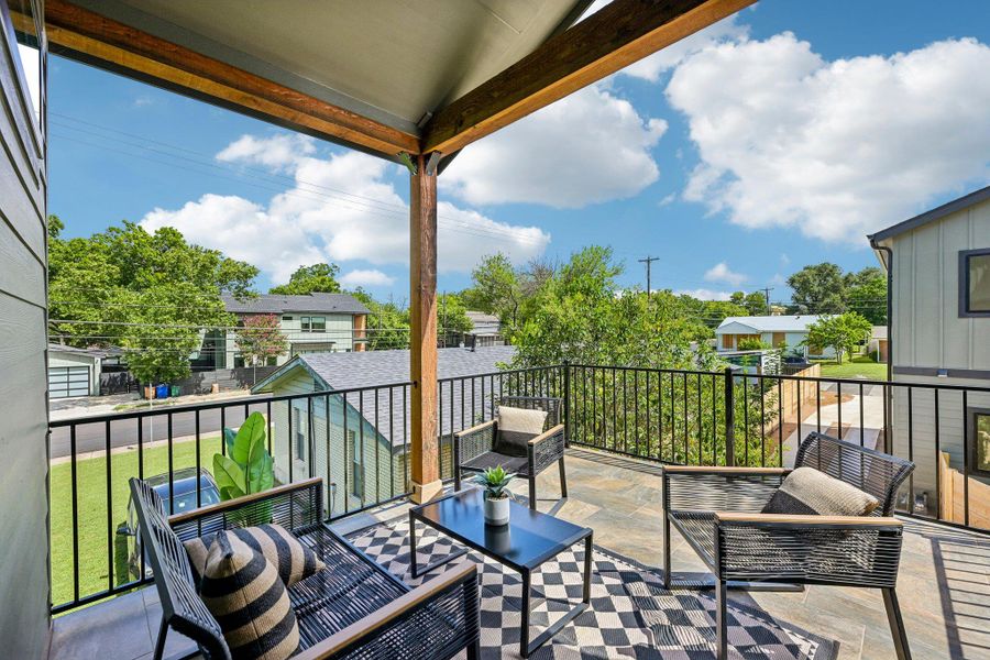 An inviting balcony offers ample space for outdoor relaxation and neighborhood views. An inviting balcony offers ample space for outdoor relaxation and neighborhood views.