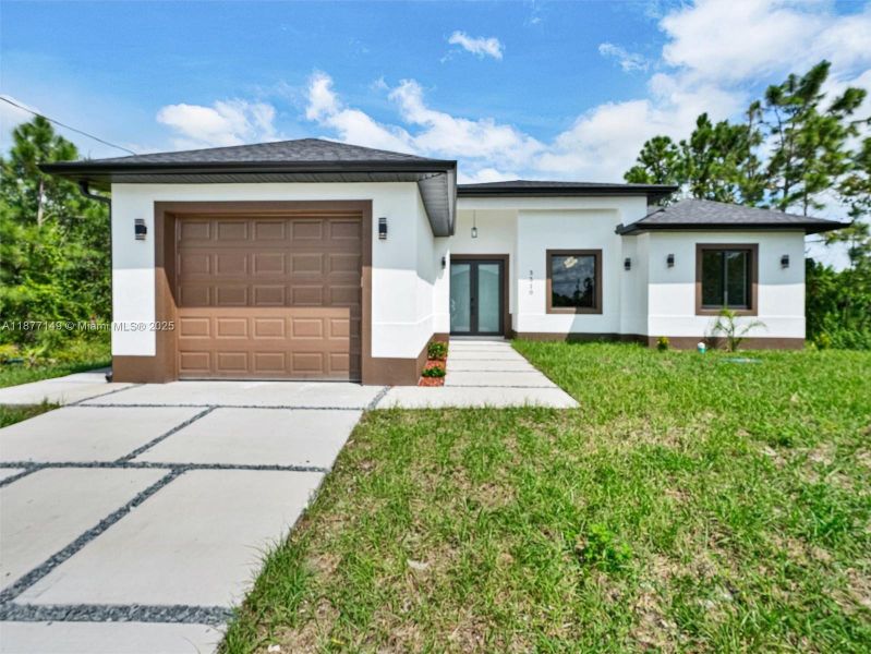 Front exterior of a new home in , Lehigh Acres, FL, highlighting curb appeal (Image 19).