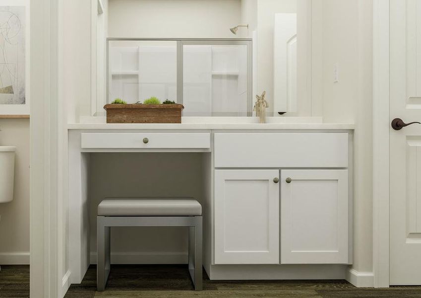 Rendering of the master bath focused on
  the sink with white cabinetry and makeup vanity. The toilet is visible on the
  other side of a wall partition. The shower is reflected in the mirror.