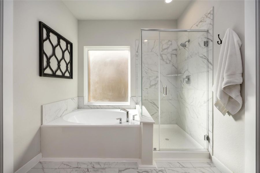 Soaking tub, separate shower, and tile surround. Soaking tub, separate shower, and tile surround.