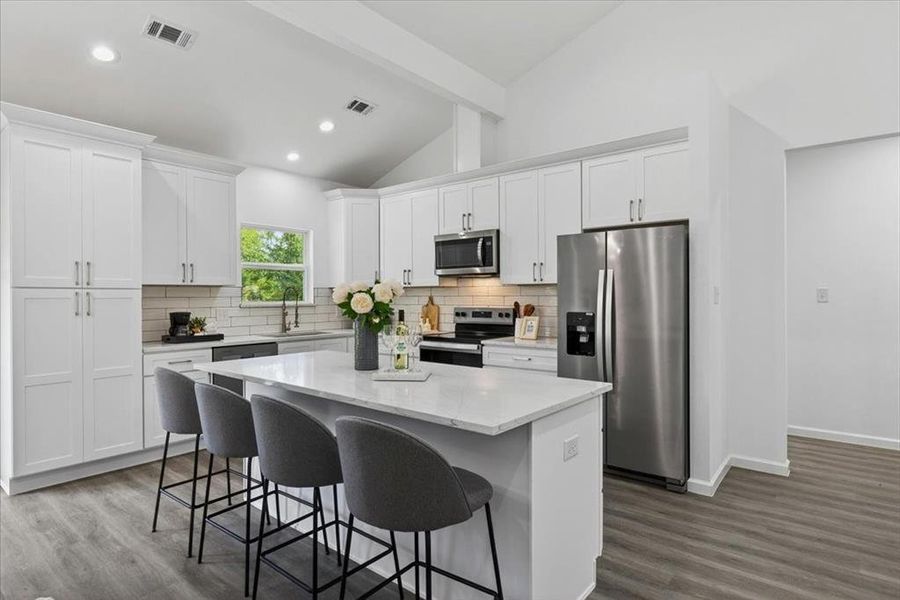 The heart of the kitchen where everyone gathers to indulge in their favorite drinks and tell stories for hours.