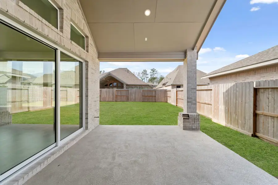 Exterior details and patio area of a home in The Highlands - 65', Porter (Image 3).