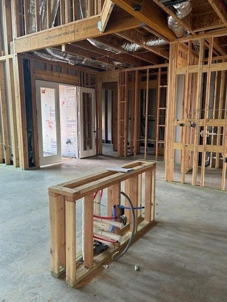 Kitchen/breakfast area has double doors leading to the back patio.