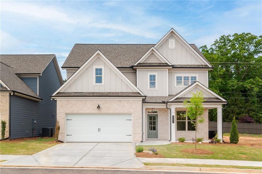 Front exterior of a new home in , Buford, GA, highlighting curb appeal (Image 1). Front exterior of a new home in , Buford, GA, highlighting curb appeal (Image 1).