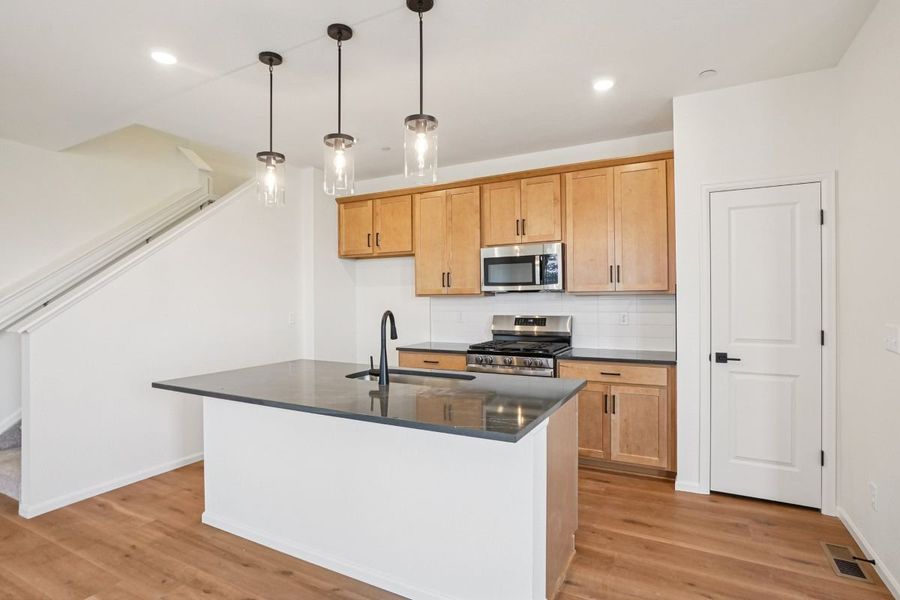 Furnished interior view inside a new home in The Nest Villas at Canyon Creek, Erie (Image 6).