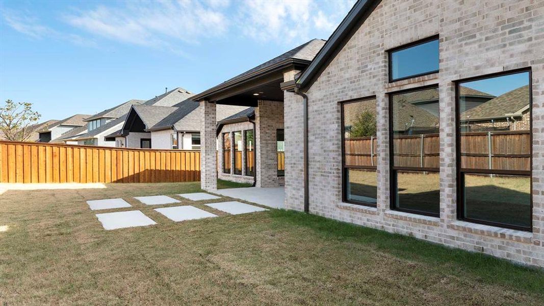 Exterior details and patio area of a home in Trinity Falls, McKinney (Image 4). Exterior details and patio area of a home in Trinity Falls, McKinney (Image 4).