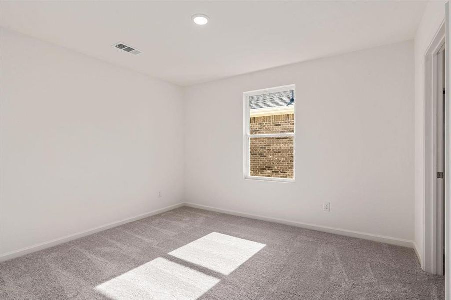 Empty room featuring light carpet and recessed lighting Empty room featuring light carpet and recessed lighting