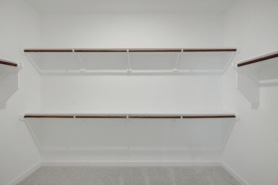 Primary walk-in closet Primary walk-in closet