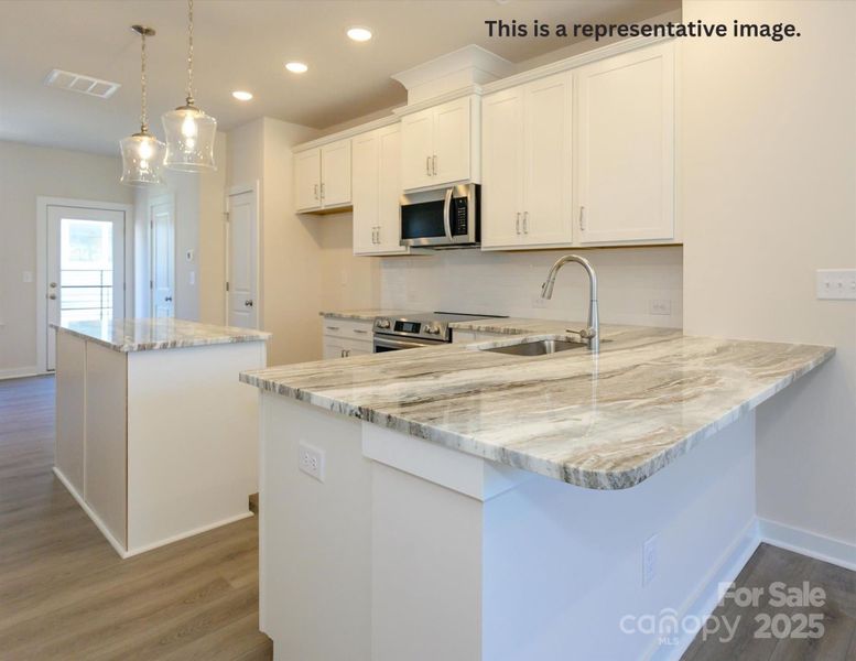 Furnished interior view inside a new home in Central Living at Craig, Charlotte (Image 4). Furnished interior view inside a new home in Central Living at Craig, Charlotte (Image 4).