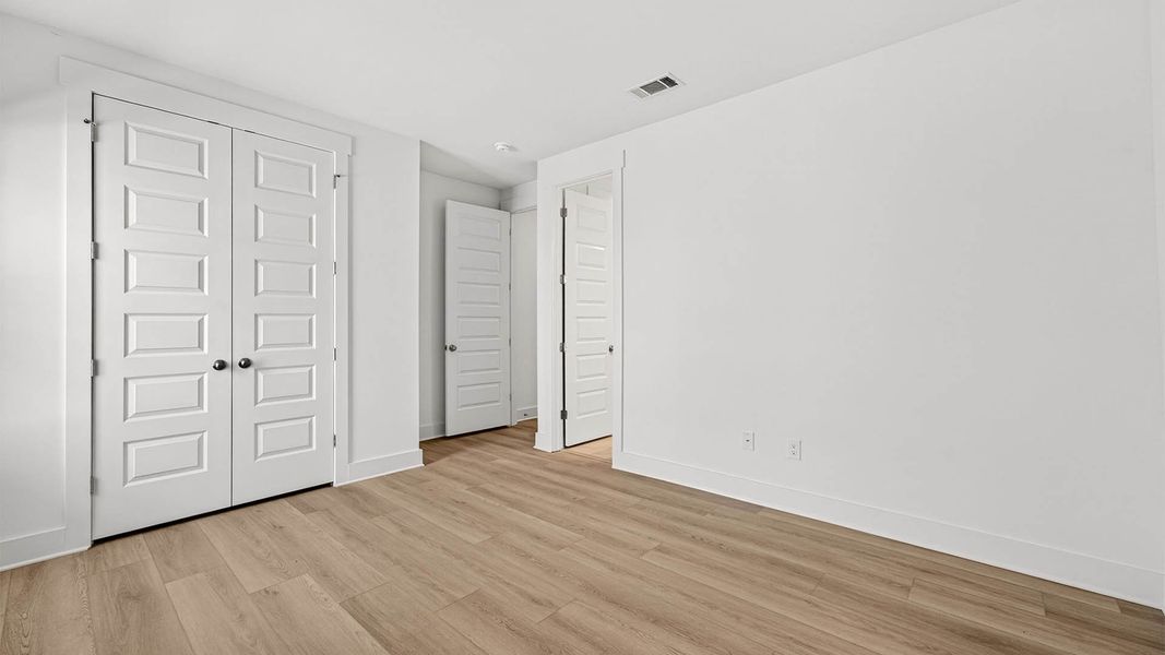 Representative unfurnished interior of a home built from the The Lily by D.R. Horton in WindMark Beach, Port Saint Joe (Image 34).