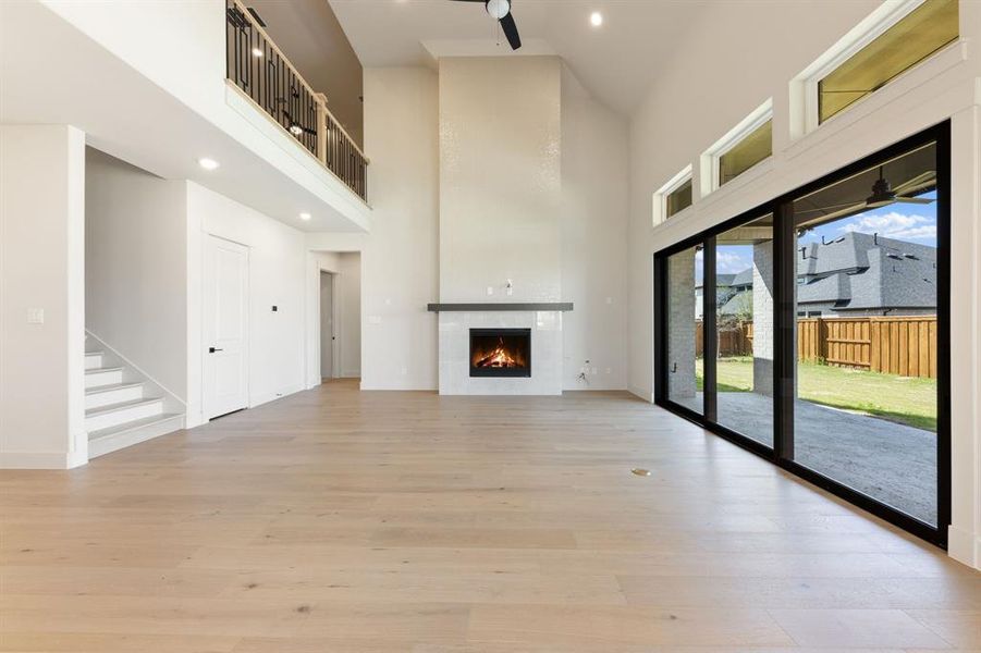 This simply stunning family room with full wall slider and dramatic fireplace offers the ideal entertainment area.