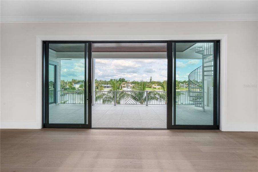 Hurricane Sliders on Spacious Second Story Terrace Opens to Water and City Views.