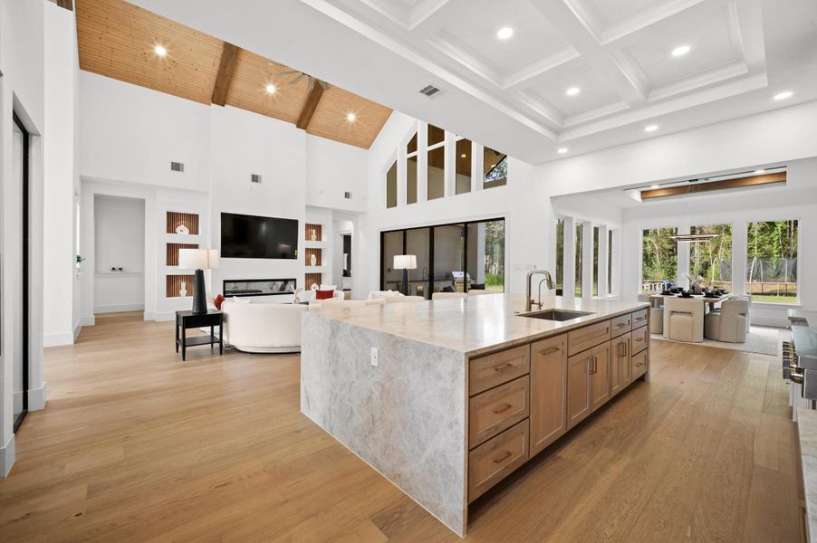 Massive waterfall island provides generous seating and prep space.