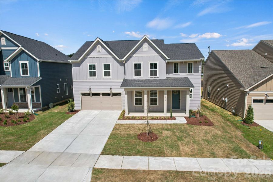 Front exterior of a new home in Parkside Crossing, Charlotte, NC, highlighting curb appeal (Image 26).