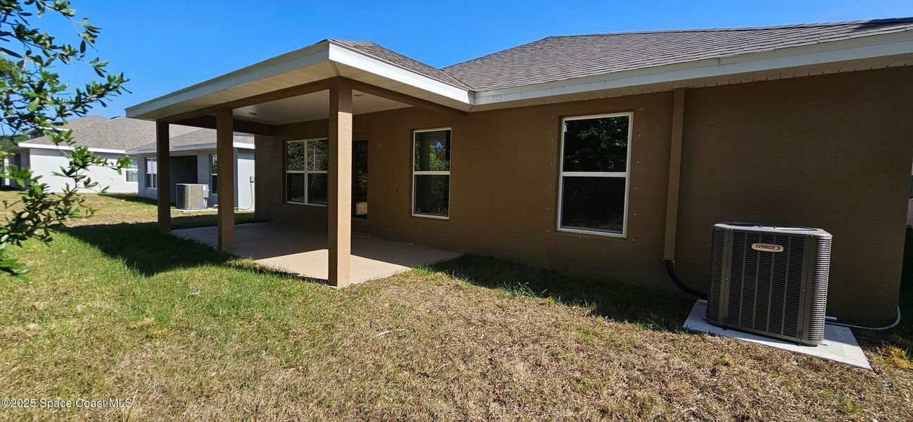 Exterior details and patio area of a home in Hickory Ridge, Cocoa, FL, Cocoa (Image 3).