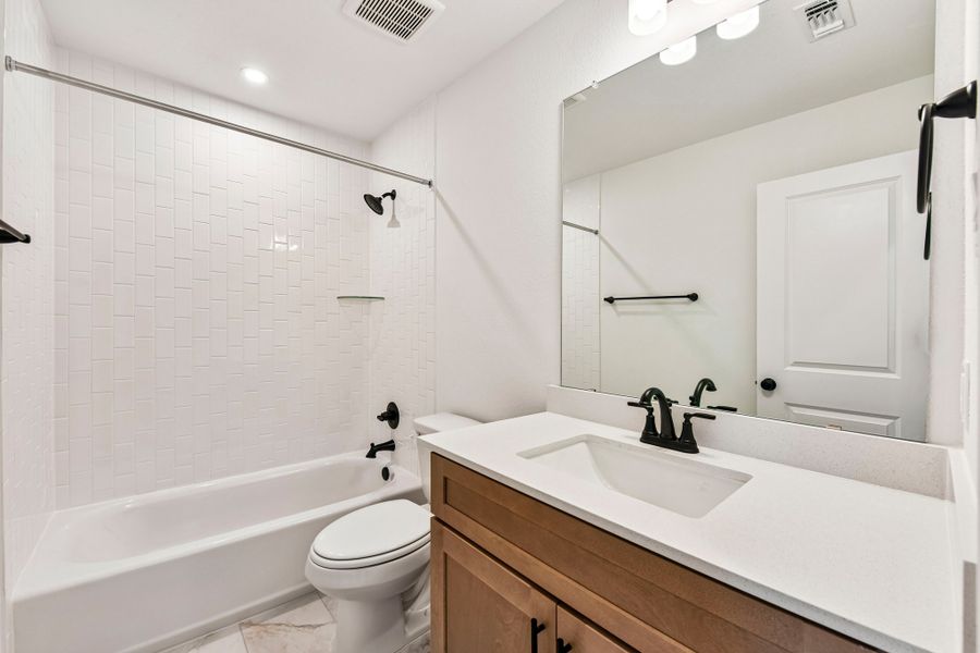 Furnished interior view inside a new home in Crosswinds, Kyle (Image 6).