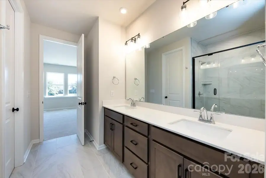 Dual Vanity Primary Bathroom with Warm Brown Cabinets Dual Vanity Primary Bathroom with Warm Brown Cabinets