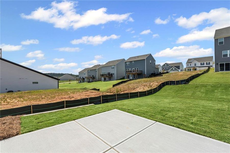 Front exterior of a new home in Twin Lakes, Hoschton, GA, highlighting curb appeal (Image 18). Front exterior of a new home in Twin Lakes, Hoschton, GA, highlighting curb appeal (Image 18).