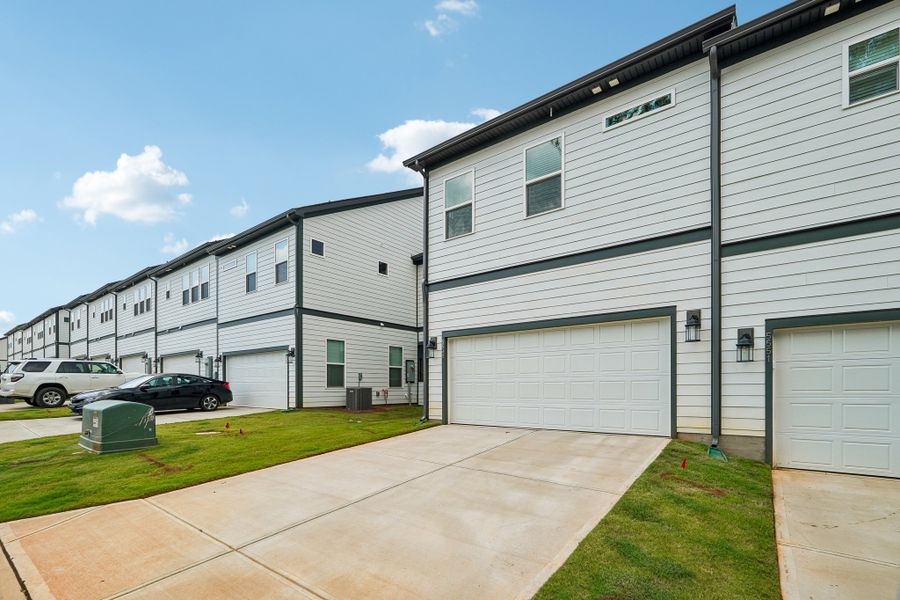 Exterior details and patio area of a home in Terraces at the Exchange, Indian Land (Image 20).
