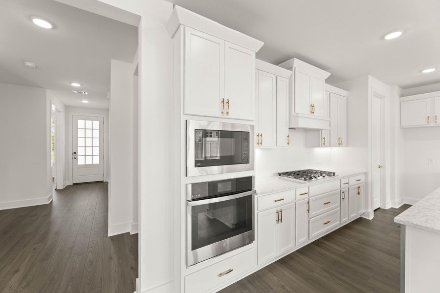 Representative furnished interior of a home built from the Laurel by Tri Pointe Homes in Treeline, Justin (Image 8).