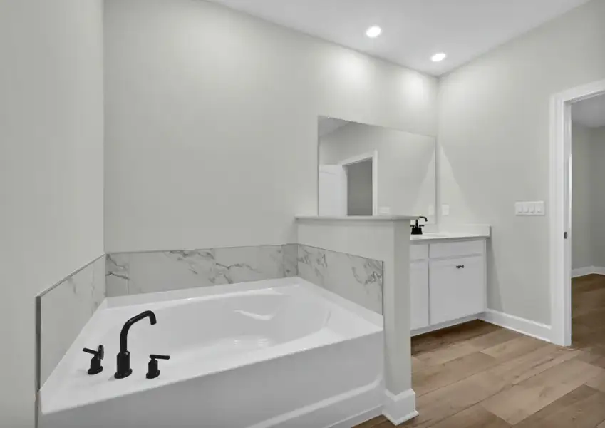Unwind in the spacious bathtub