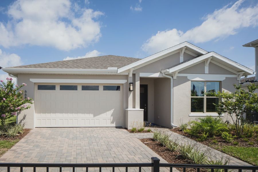 Representative exterior photo of a completed home built from the Eola II by Jones Homes USA in Reserve at Twin Lakes, St. Cloud, FL (Image 7). Representative exterior photo of a completed home built from the Eola II by Jones Homes USA in Reserve at Twin Lakes, St. Cloud, FL (Image 7).