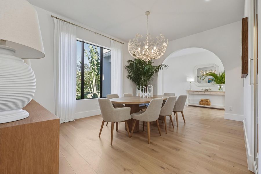 Formal dining room with stunning oversized window & view of garden