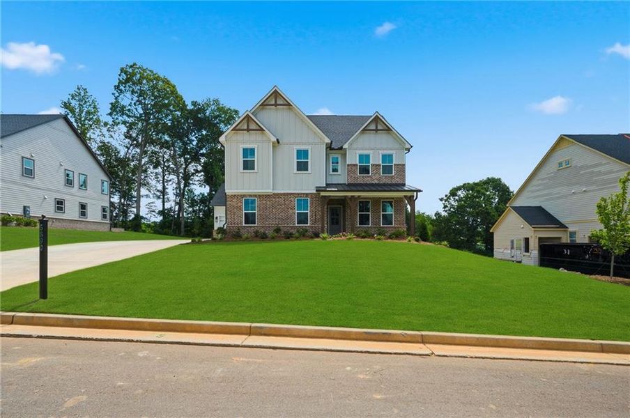 Front exterior of a new home in Acacia, Cumming, GA, highlighting curb appeal (Image 24). Front exterior of a new home in Acacia, Cumming, GA, highlighting curb appeal (Image 24).