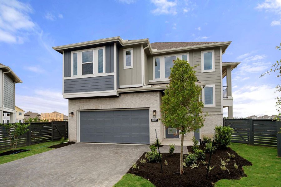 Front exterior of a new home in Bridgeland, Cypress, TX, highlighting curb appeal (Image 2).