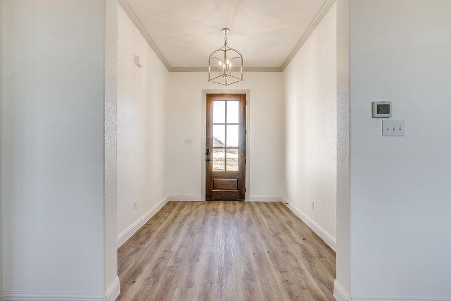 Representative unfurnished interior of a home built from the Augusta Court by Trinity Classic Homes in Zion Trails, Poolville (Image 26).