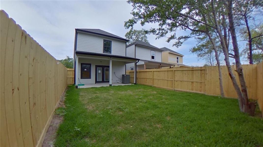 7920 James Franklin St backyard with covered patio.