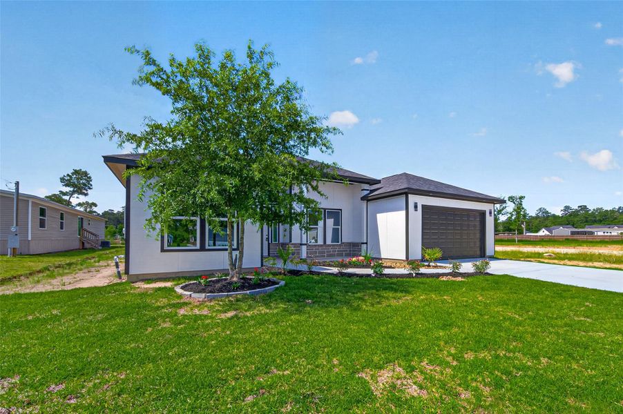 Inviting modern farmhouse exterior with clean architectural lines, charming curb appeal, and thoughtfully designed landscaping.