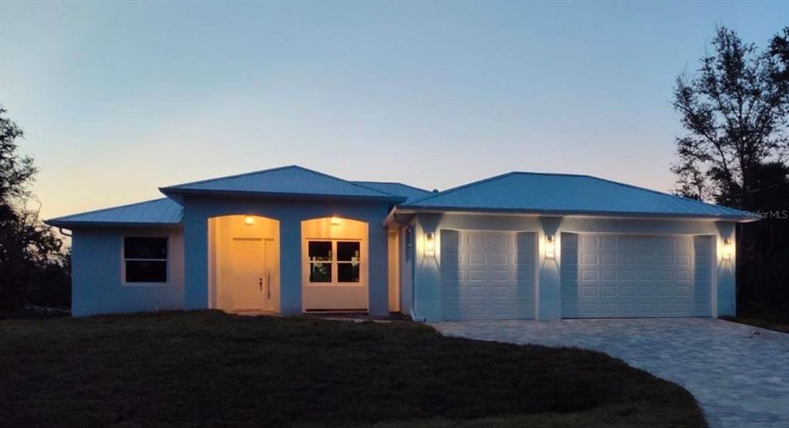 Front exterior of a new home in , Port Charlotte, FL, highlighting curb appeal (Image 17).