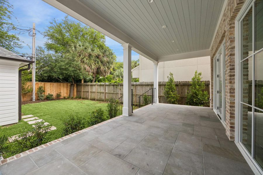 Expansive covered back patio. There is a gas connection to add a grill and summer kitchen.