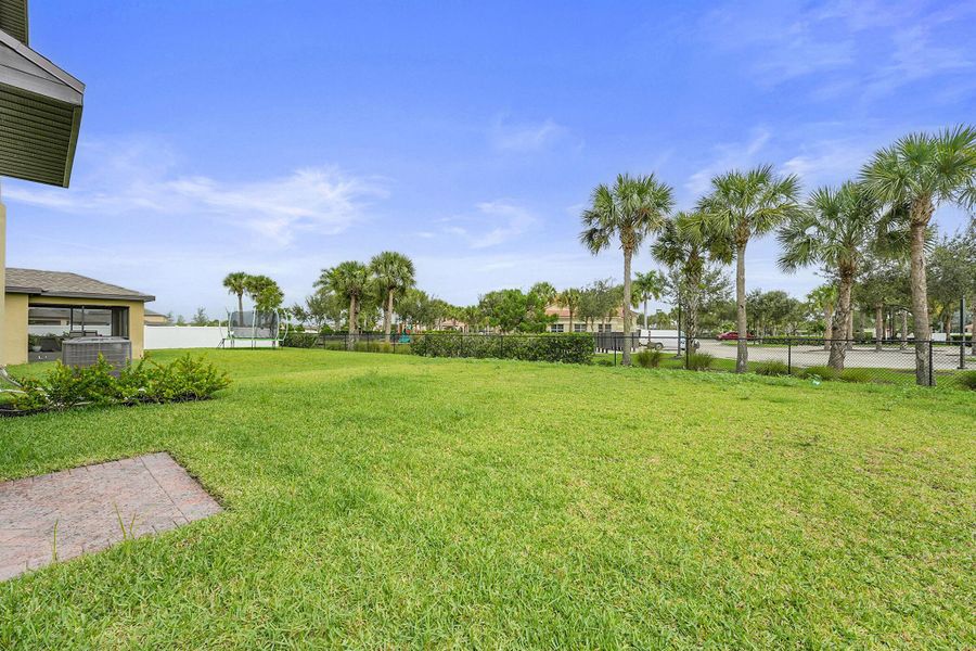 Front exterior of a new home in Bent Creek: The Meadows Collection, Fort Pierce, FL, highlighting curb appeal (Image 17).