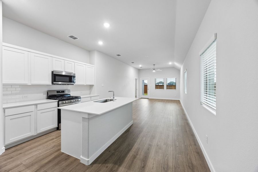 Kitchen in the Cedar home plan by Trophy Signature Homes – REPRESENTATIVE PHOTO