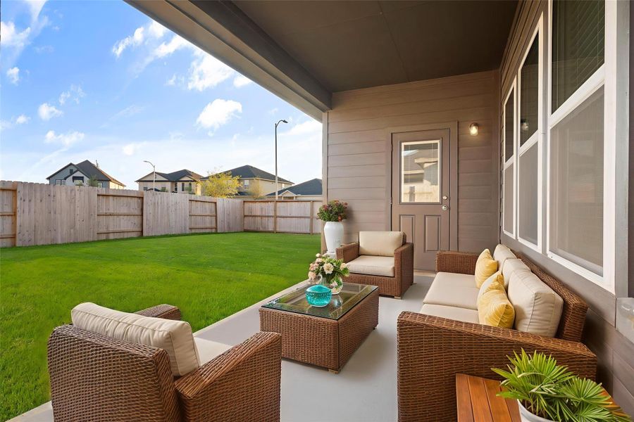 Enjoy outdoor living on the covered patio that provides the perfect space for relaxing or entertaining guests. With plenty of room for seating and decor, this peaceful setting invites you to unwind and take in views of the lush backyard. Virtural staged. Enjoy outdoor living on the covered patio that provides the perfect space for relaxing or entertaining guests. With plenty of room for seating and decor, this peaceful setting invites you to unwind and take in views of the lush backyard. Virtural staged.