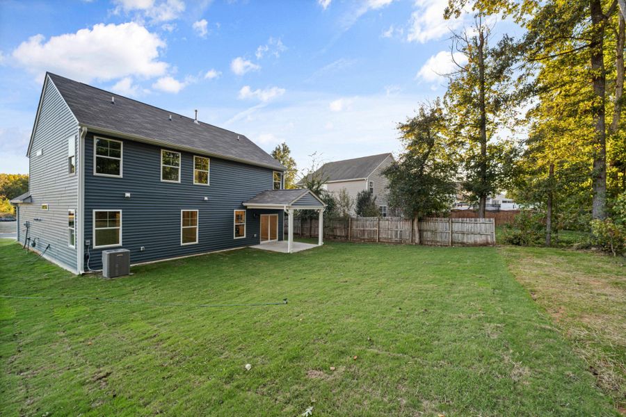 Exterior details and patio area of a home in Chandler Ridge, McLeansville (Image 21).