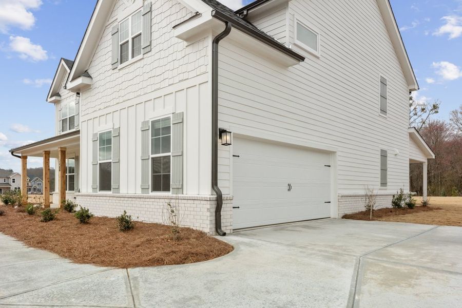 A white house with a garage. A white house with a garage.